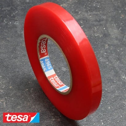 Tesa 4965, double-sided adhesive PET tape, very strong acrylic adhesive, red foil cover 12 mm